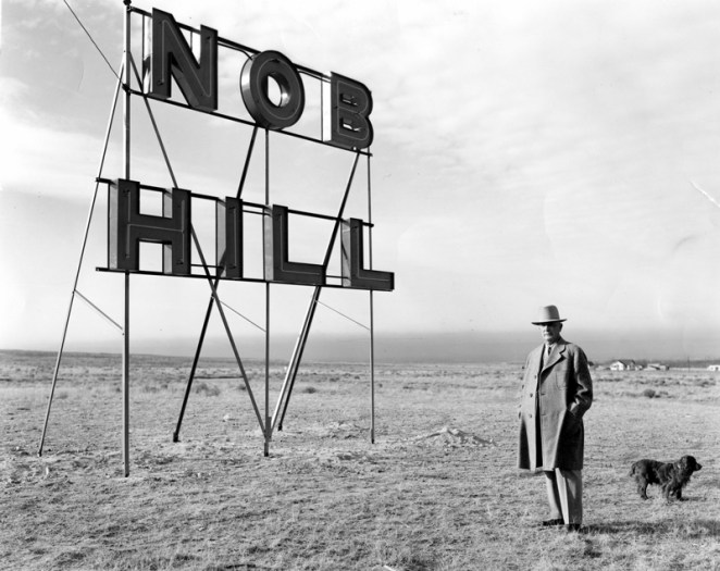 1938 | D.K.B. Sellers with his dog and Nob Hill sign